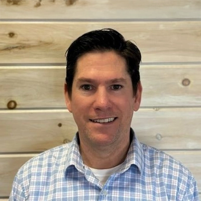 A headshot of Dr. John Mills, an eye doctor of the Mills Vision Care